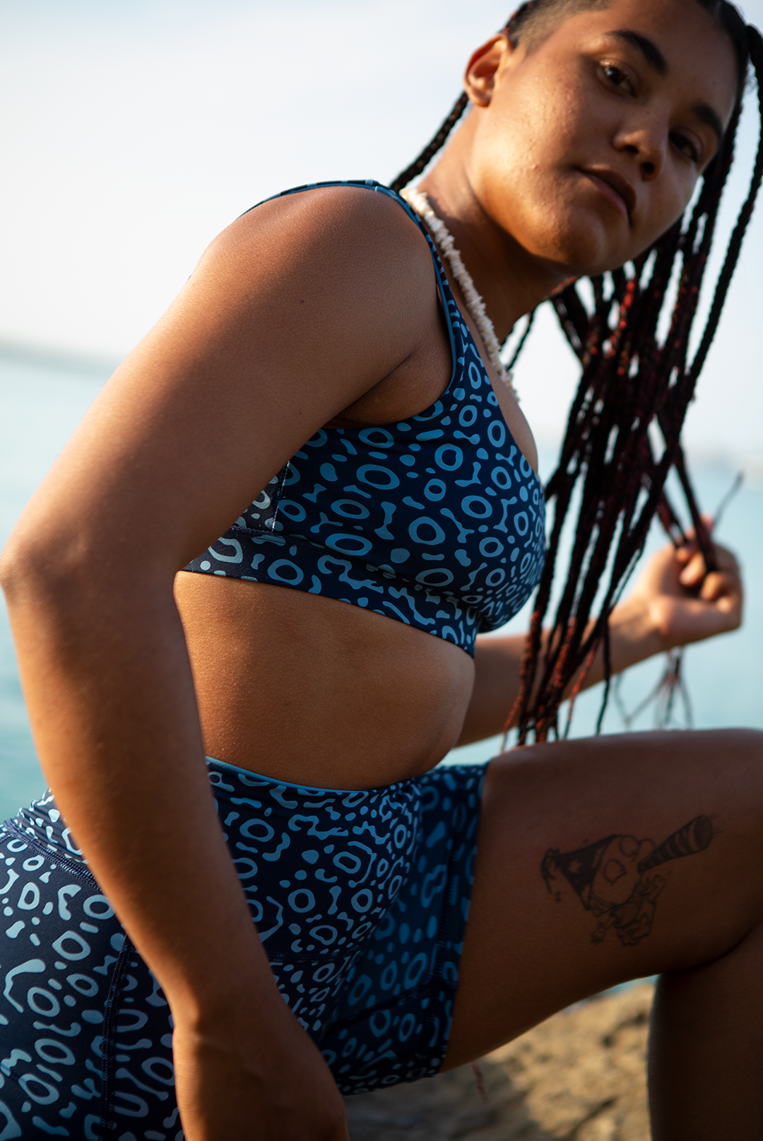 Women’s Eagle Ray print biker shorts in two-tone blue, eco-friendly apparel active swimwear with high waist and side pockets, marine animal prints sustainable UK.