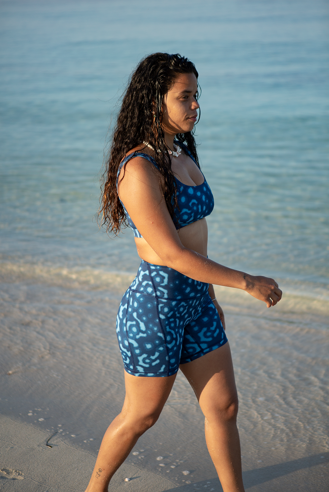 Close-up of high waist biker shorts with Whale Shark print in blue and white, eco-friendly apparel active swimwear, women’s side pocket biker shorts UK.