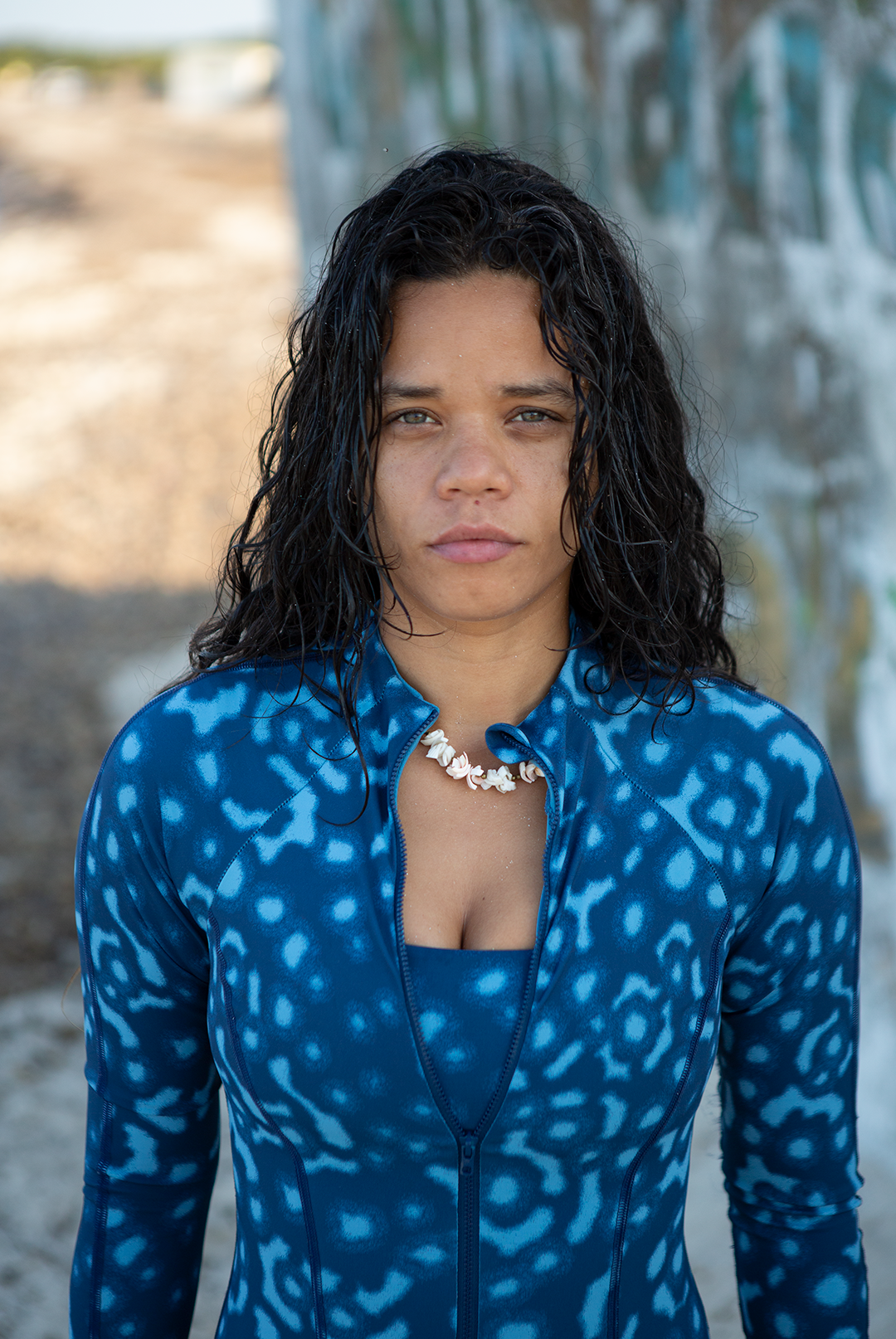 Women’s long-sleeve one-piece Whale Shark print swimsuit in shades of blue, eco-friendly surf swimwear, marine animal prints sustainable swimwear UK.