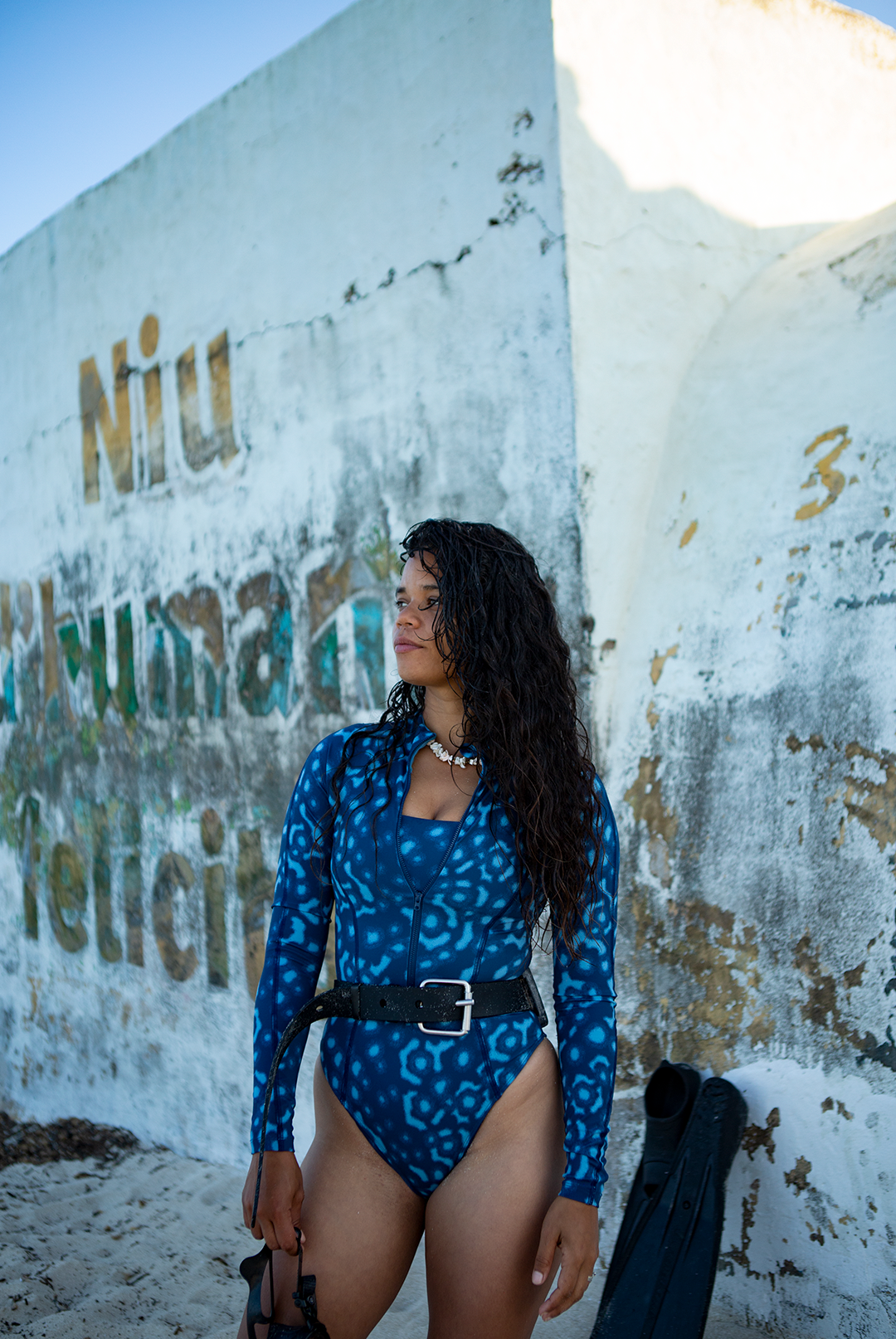 Women’s long-sleeve one-piece Whale Shark print swimsuit in shades of blue, eco-friendly surf swimwear, marine animal prints sustainable swimwear UK.