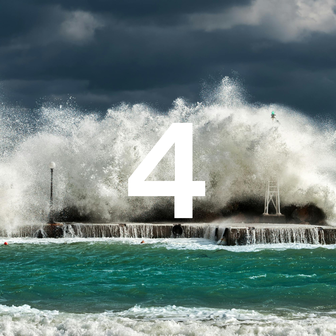 Large wave crashing against a pier with the number '4' superimposed, dark clouds in the sky.