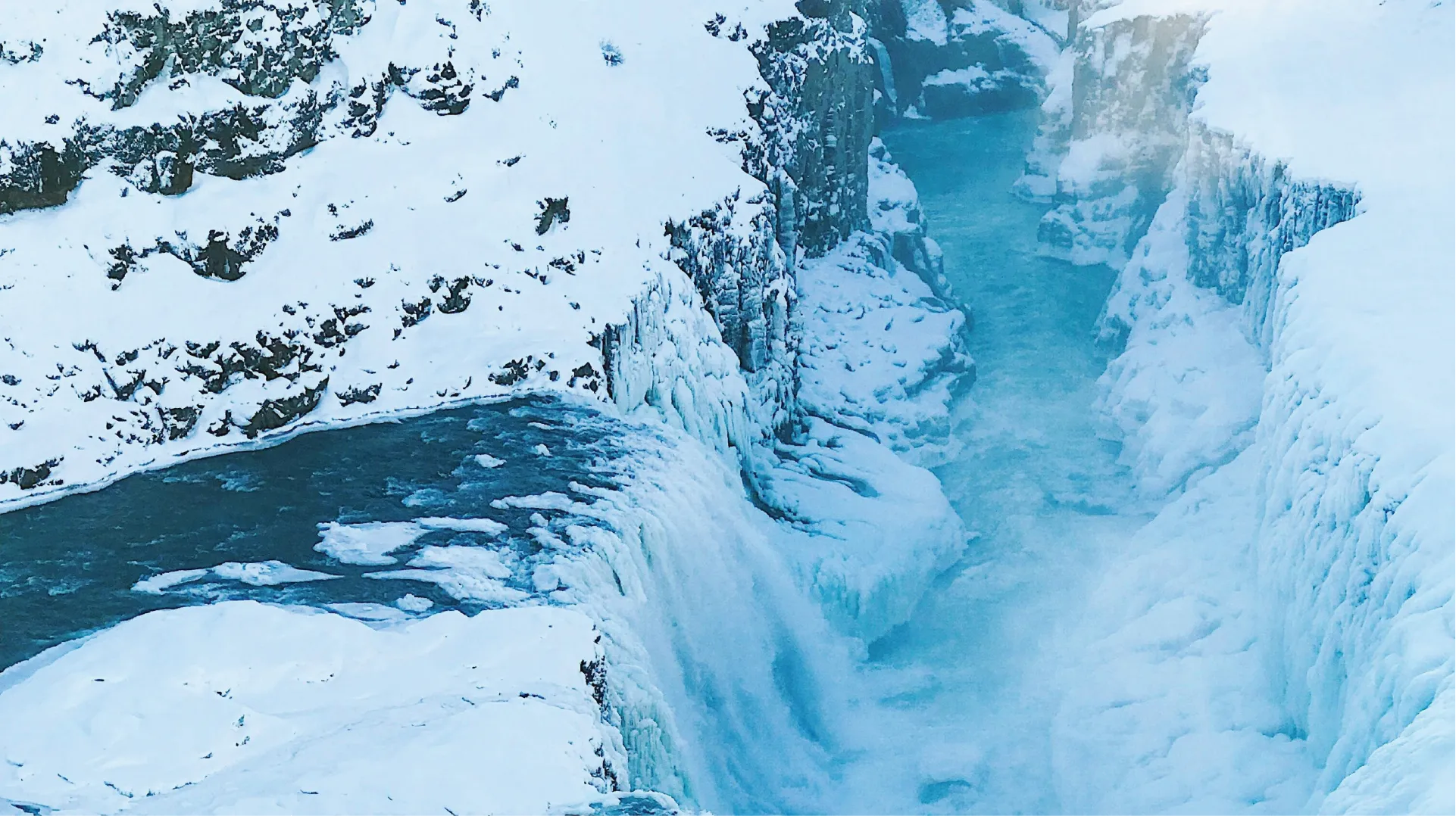 Frozen waterfall in a snowy landscape