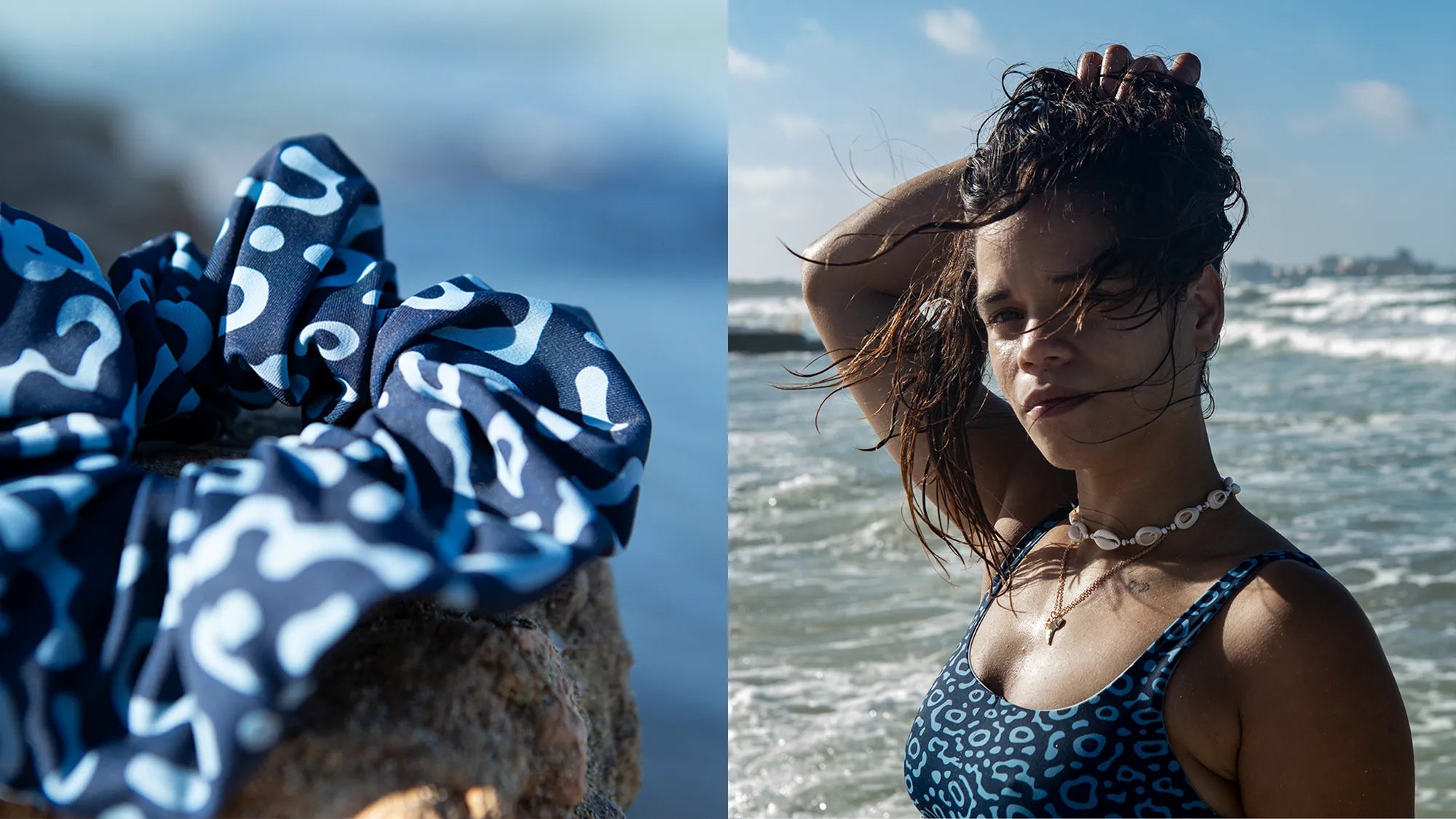 Close-up of an ocean-inspired fabric scrunchie on coastal rocks beside the sea.