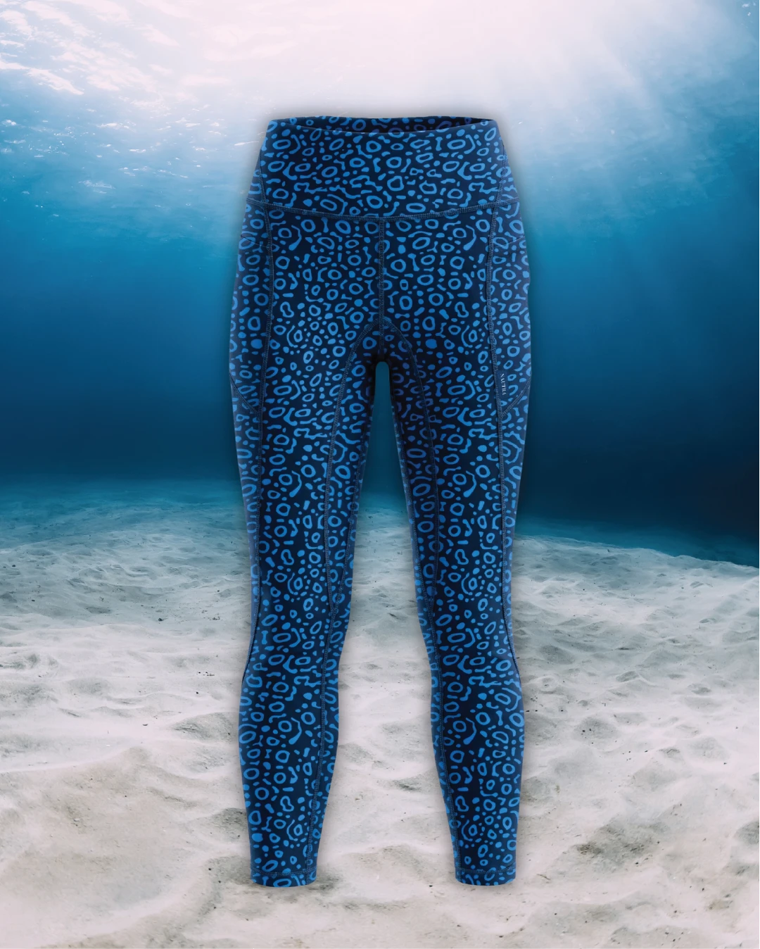 Eagle Ray Full Length Active Swim Leggings front view on ghost mannequin, made from recycled fishing nets and designed for movement in and around the water.