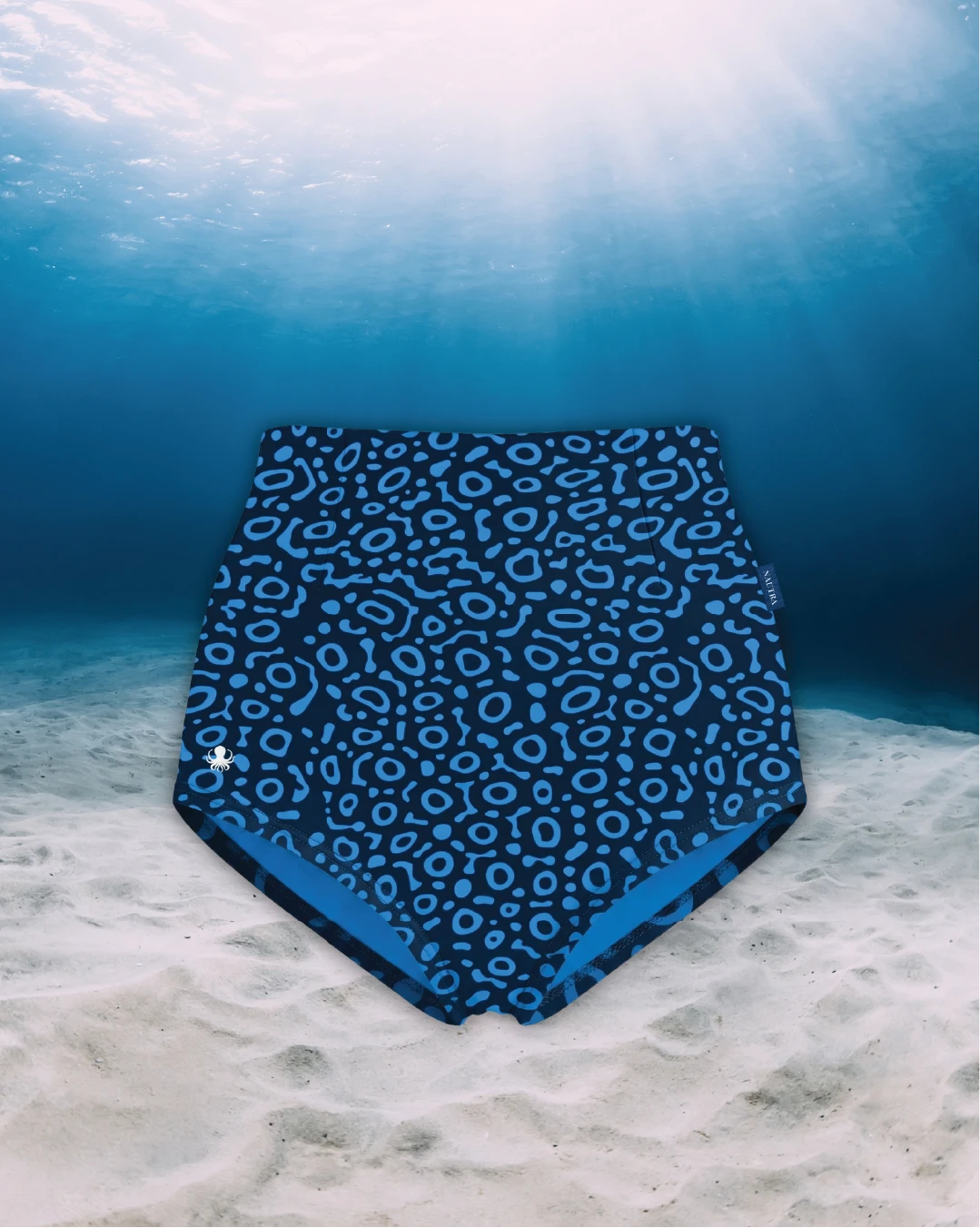 Eagle Ray High Waisted Surf Shorts front view on ghost mannequin, made from recycled fishing nets and designed for movement in and around the water.