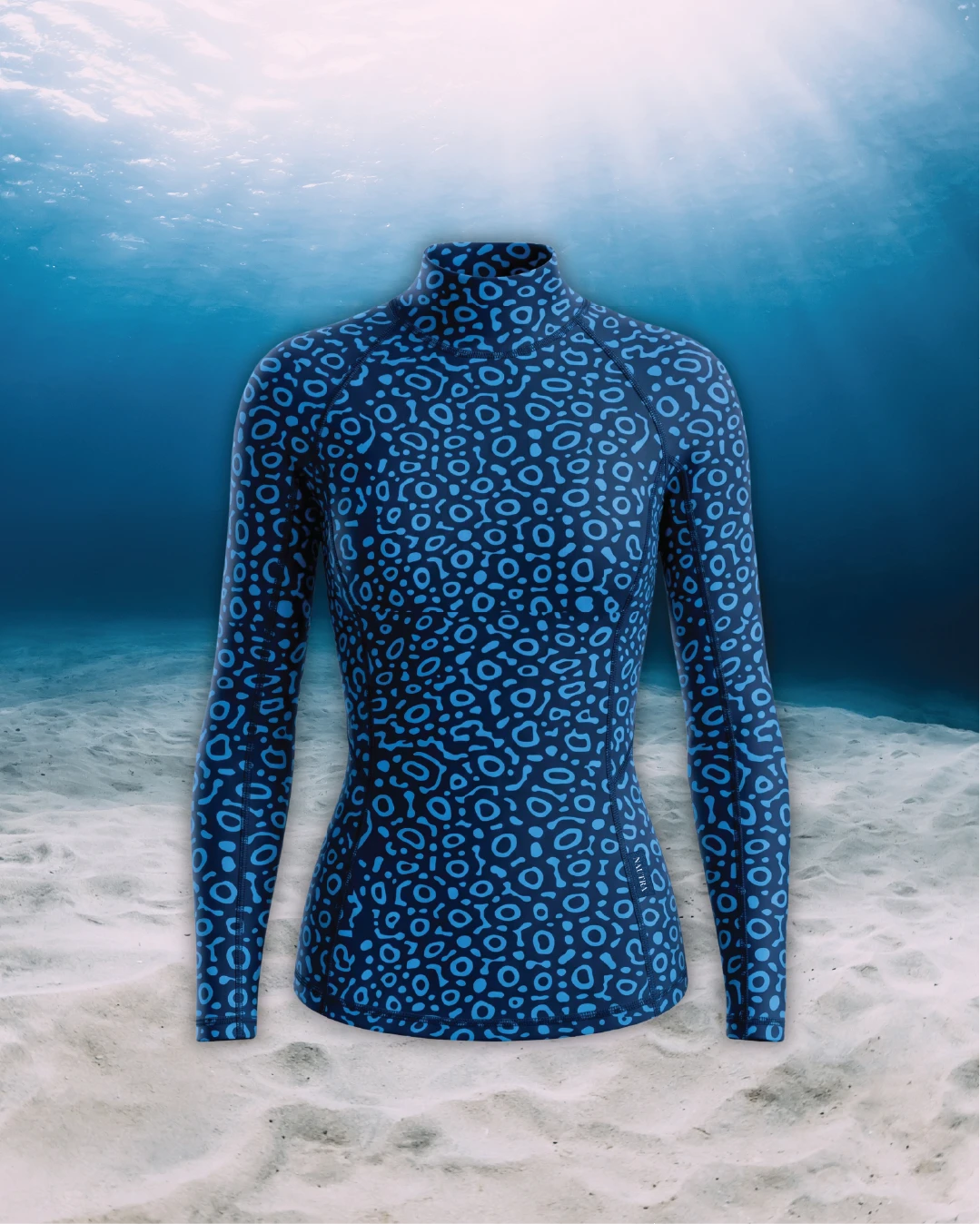 Eagle Ray Long Sleeve Rashguard front view on ghost mannequin, made from recycled fishing nets and designed for movement in and around the water.