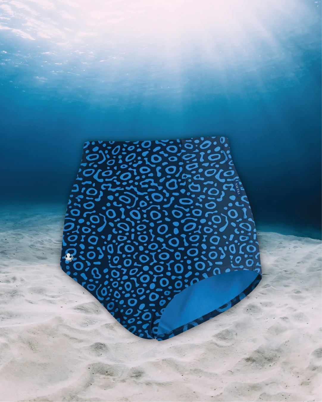 Eagle Ray High Waisted Surf Shorts side view on ghost mannequin, made from recycled fishing nets and designed for movement in and around the water.