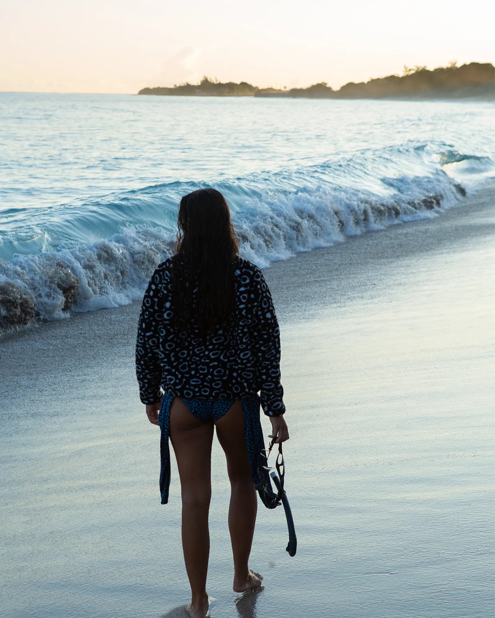 Back view of the NAUTRA Eagle Ray Recycled Sherpa Half Zip Fleece showing eagle ray inspired pattern.