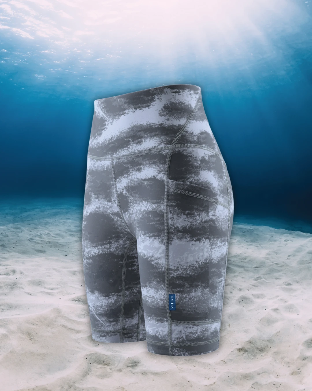 Tiger Shark Active Swim Biker Shorts side view on ghost mannequin, made from recycled fishing nets and designed for movement in and around the water.