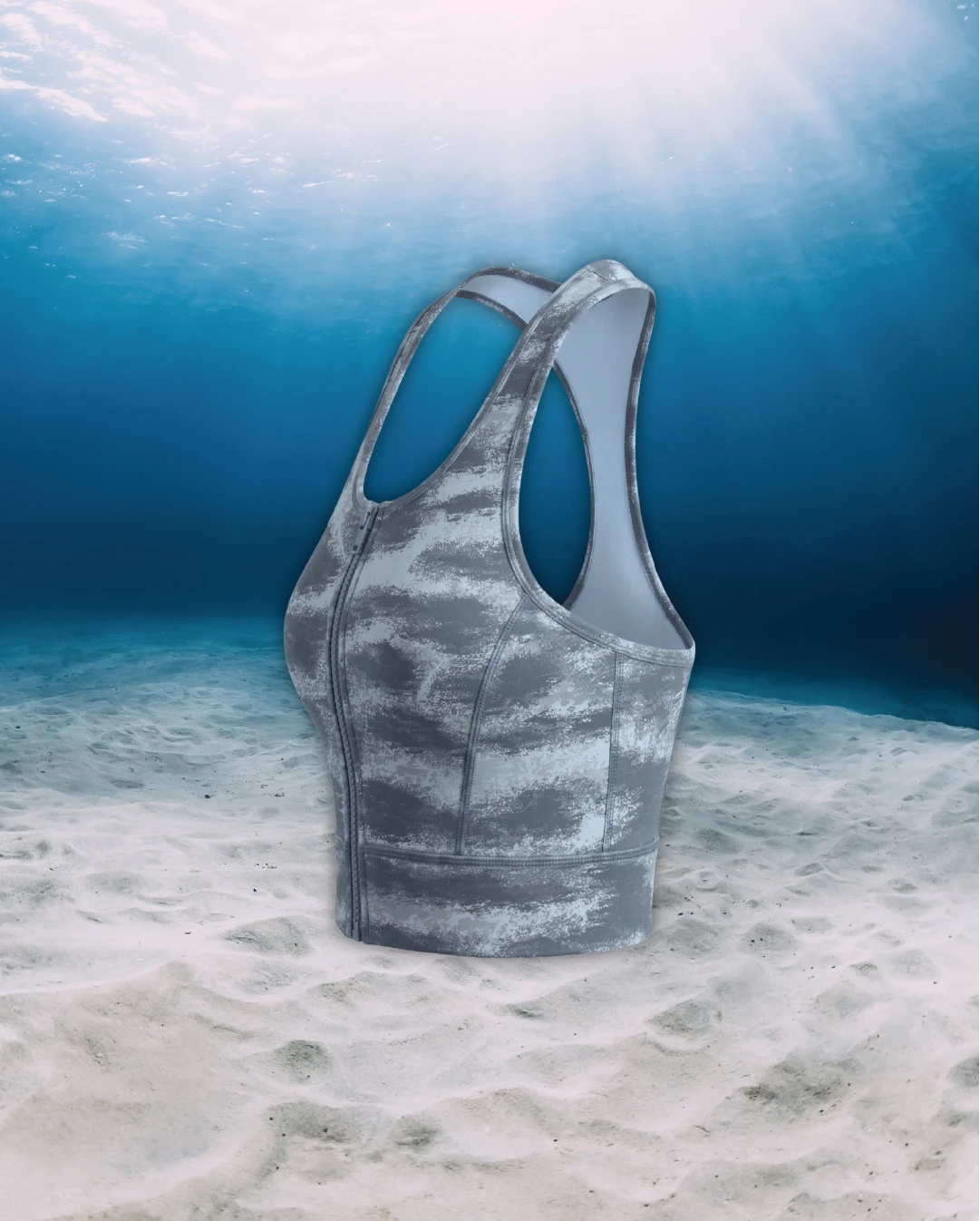 Tiger Shark Racer Back Zip Sports Bra Bikini Top side view on ghost mannequin, made from recycled fishing nets and designed for movement in and around the water.