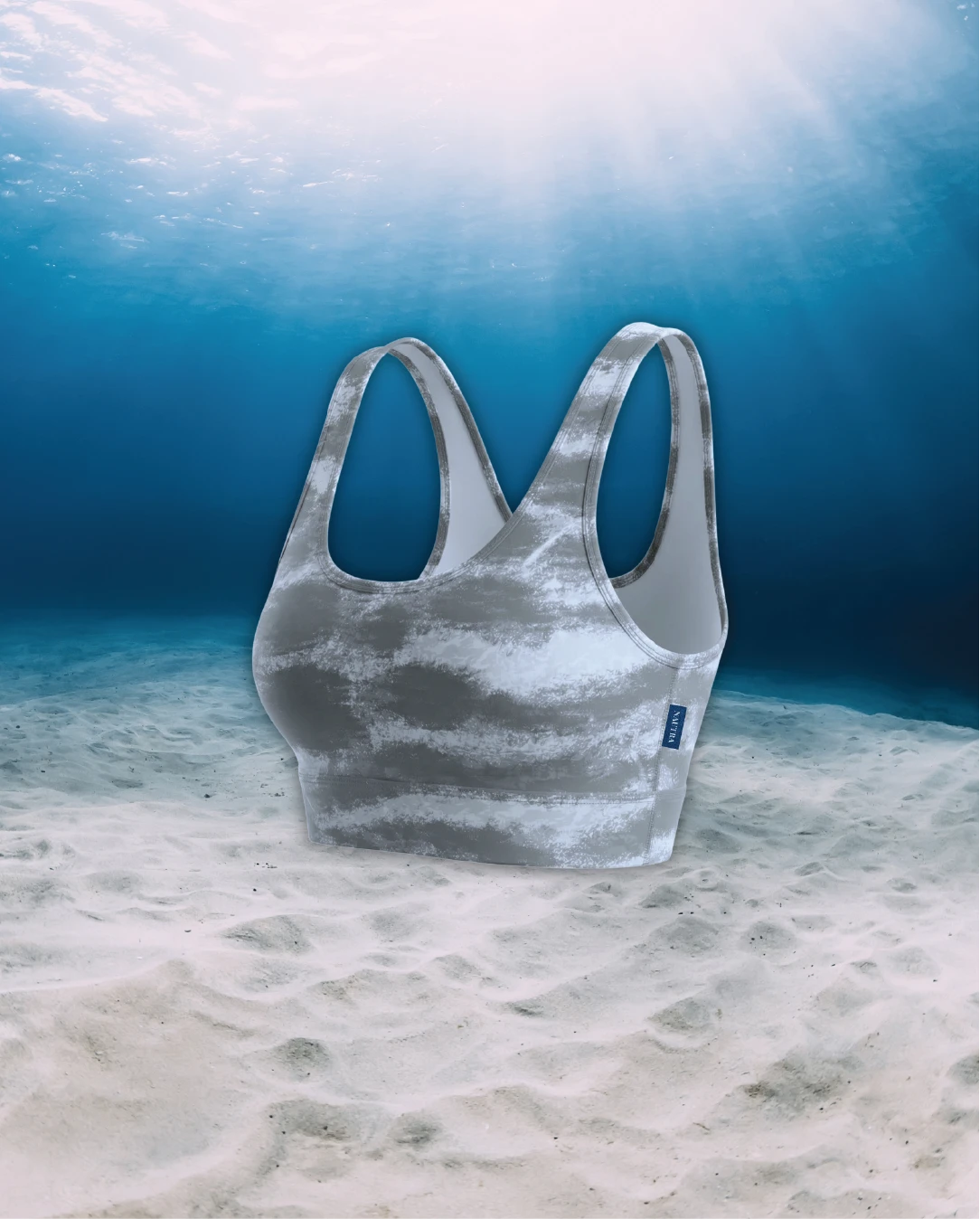 Tiger Shark Scoop Neck Sports Bra Bikini Top side view on ghost mannequin, made from recycled fishing nets and designed for movement in and around the water.