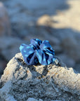 Whale shark print scrunchie on a rock with a blurred natural background